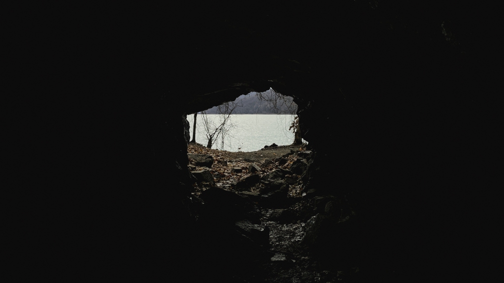 Looking out from within. Inside of a narrow cave that overlooks the Hudson River. This cave can be found at Little Stony Point.